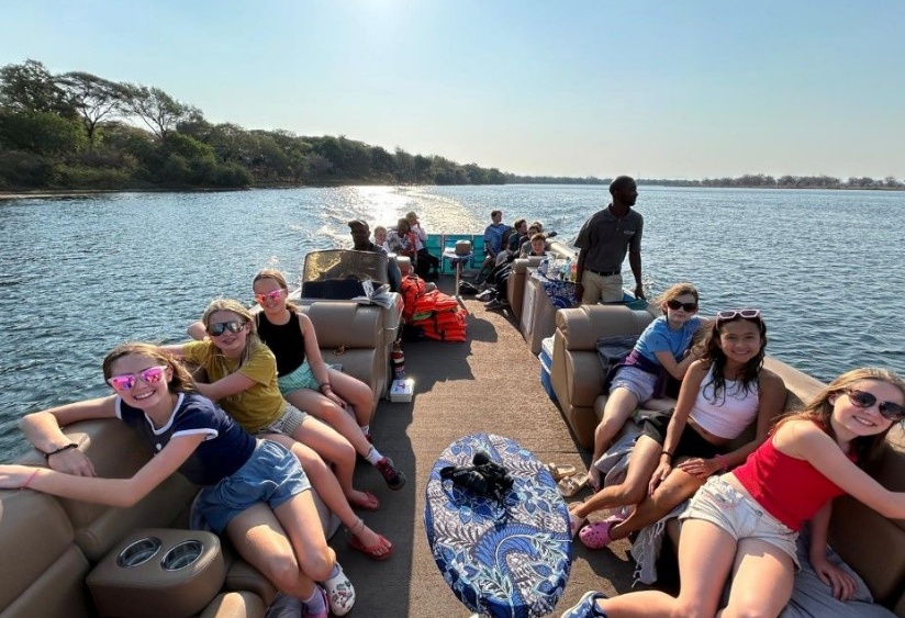 Year 8 pupils enjoy the views from a boat safari on the Zambezi River